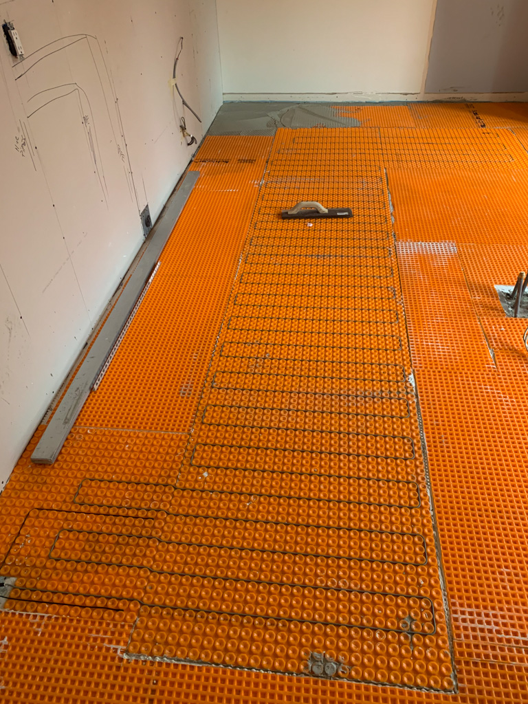 Kitchen with large format tiles and heated floors